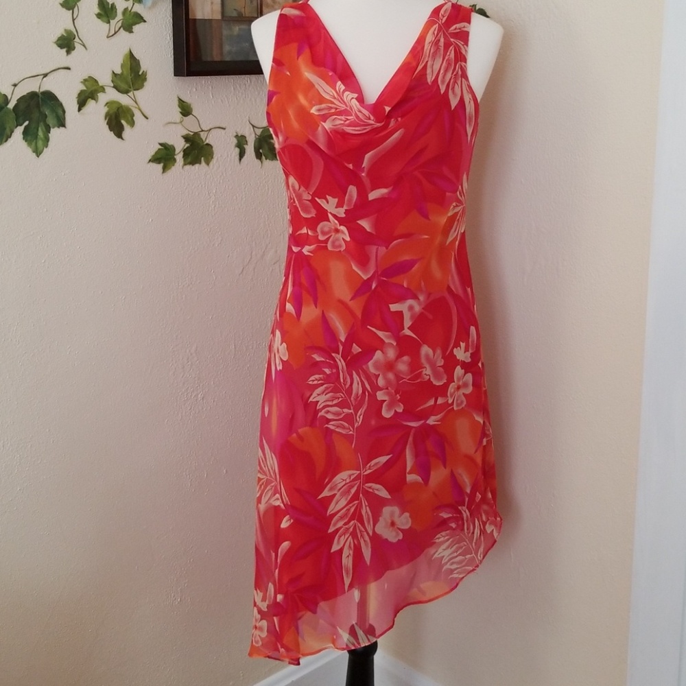 Red sleeveless asymmetrical hem dress.